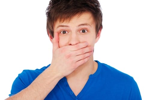 Man Covering His Mouth Because He Has A Broken Tooth