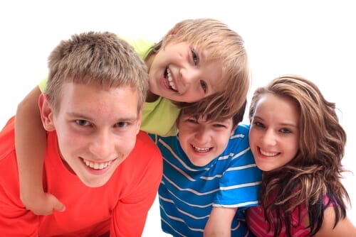 Four Young Kids Smiling After Their Dentist Appointment